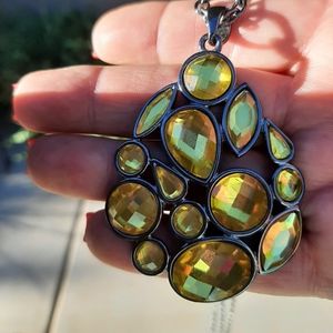 Golden faceted Swarovski cut crystals set in a gun metal finish